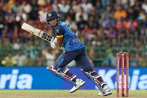 Dunith Wellalage plays a shot against India